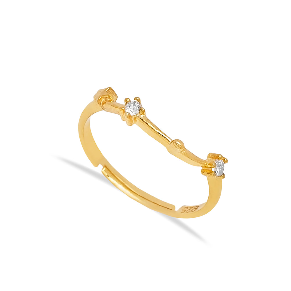 Elegant golden Aquarius ring with sparkling cubic zirconia stones, showcasing a minimalist and sophisticated design for the Twin Jewellery brand.