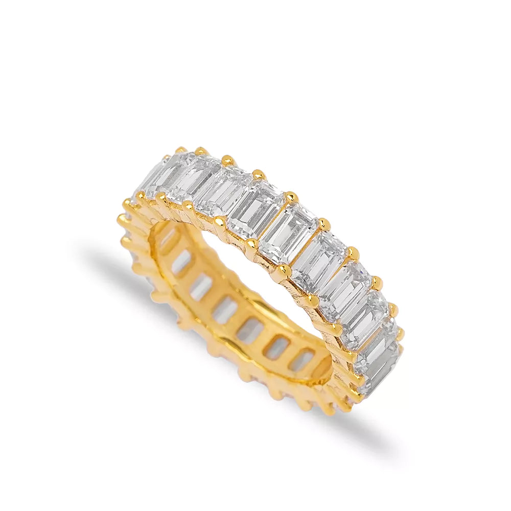 Baguette Cut Ring: A stunning gold-toned ring featuring an array of baguette-cut diamonds arranged in an elegant, eternity-style design.