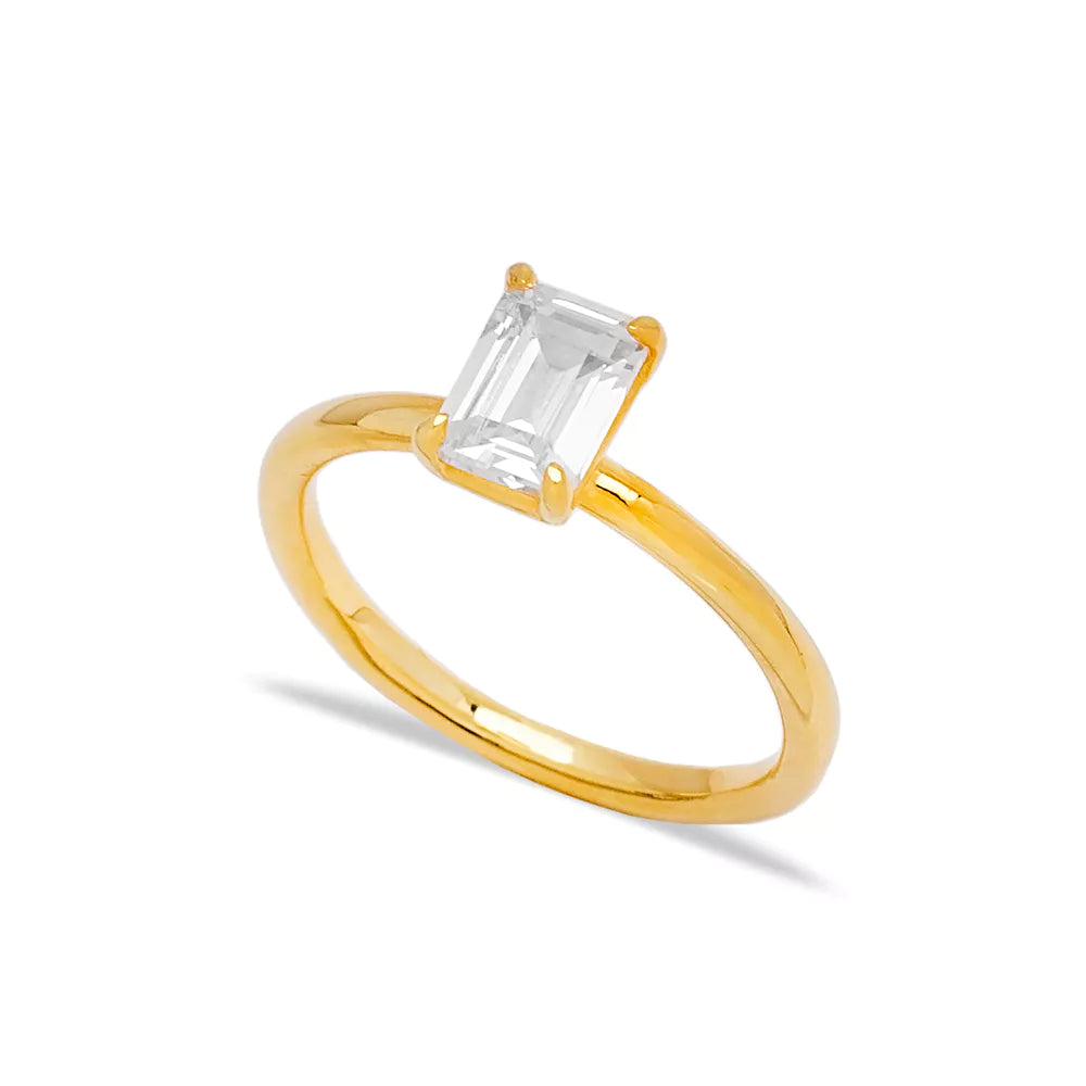 Elegant solitaire baguette stone ring from Twin Jewellery, featuring a brilliant clear crystal gem set in a sleek 14k gold band.