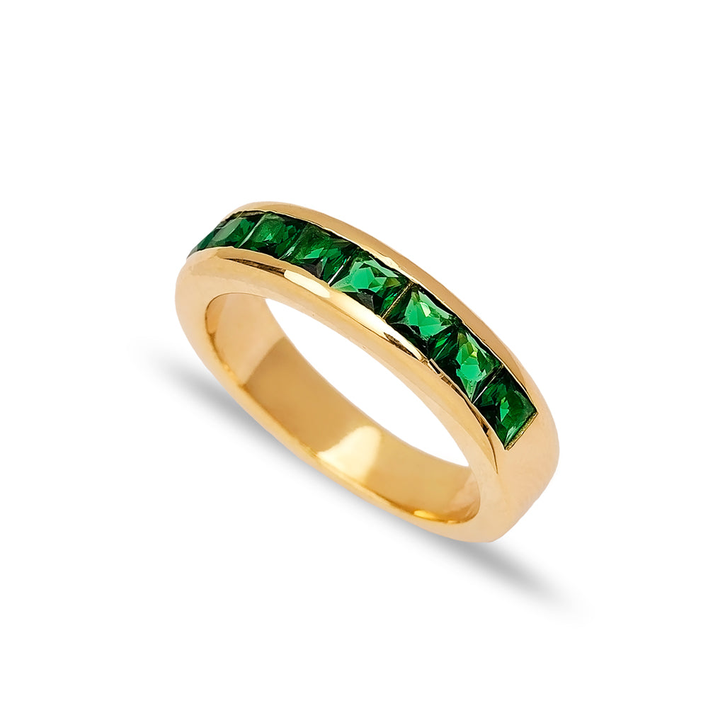 Elegant gold band ring with emerald-green square-cut gemstones from Twin Jewellery.