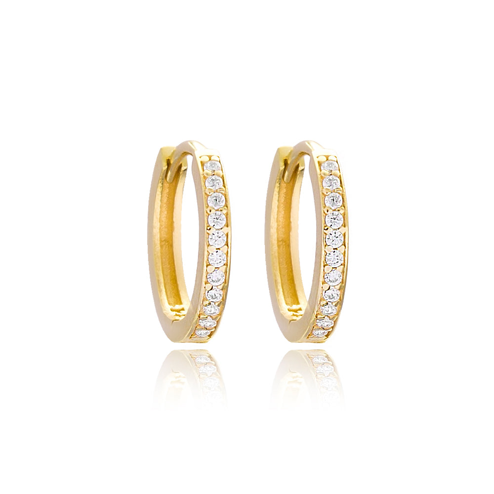 Minimalistic gold-colored hoop earrings adorned with sparkling crystals, displaying a sophisticated and elegant design.