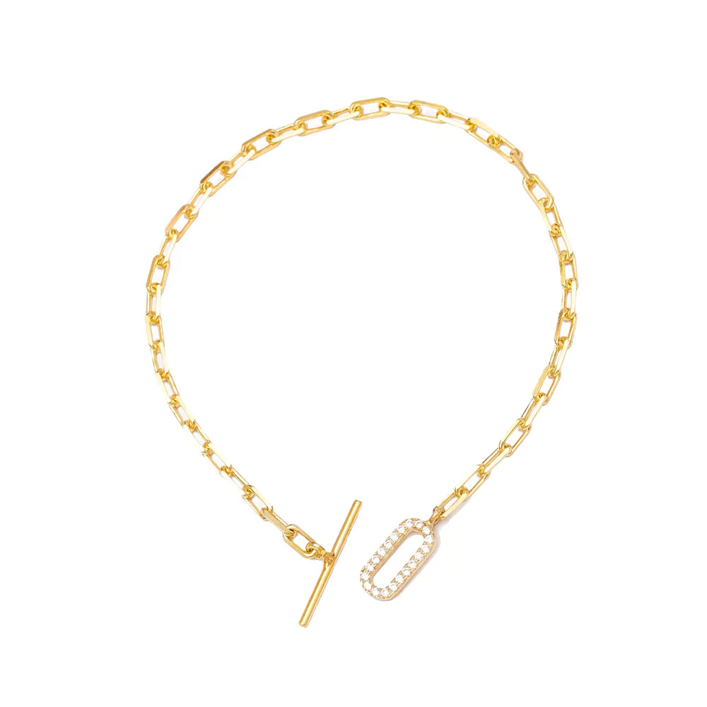 Elegant gold-toned rectangle bracelet from Twin Jewellery featuring a subtle diamond accent clasp.